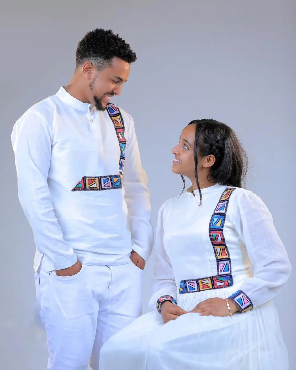 Modern and Colorful Habesha Couple's Outfits for a Stylish and Unique Look