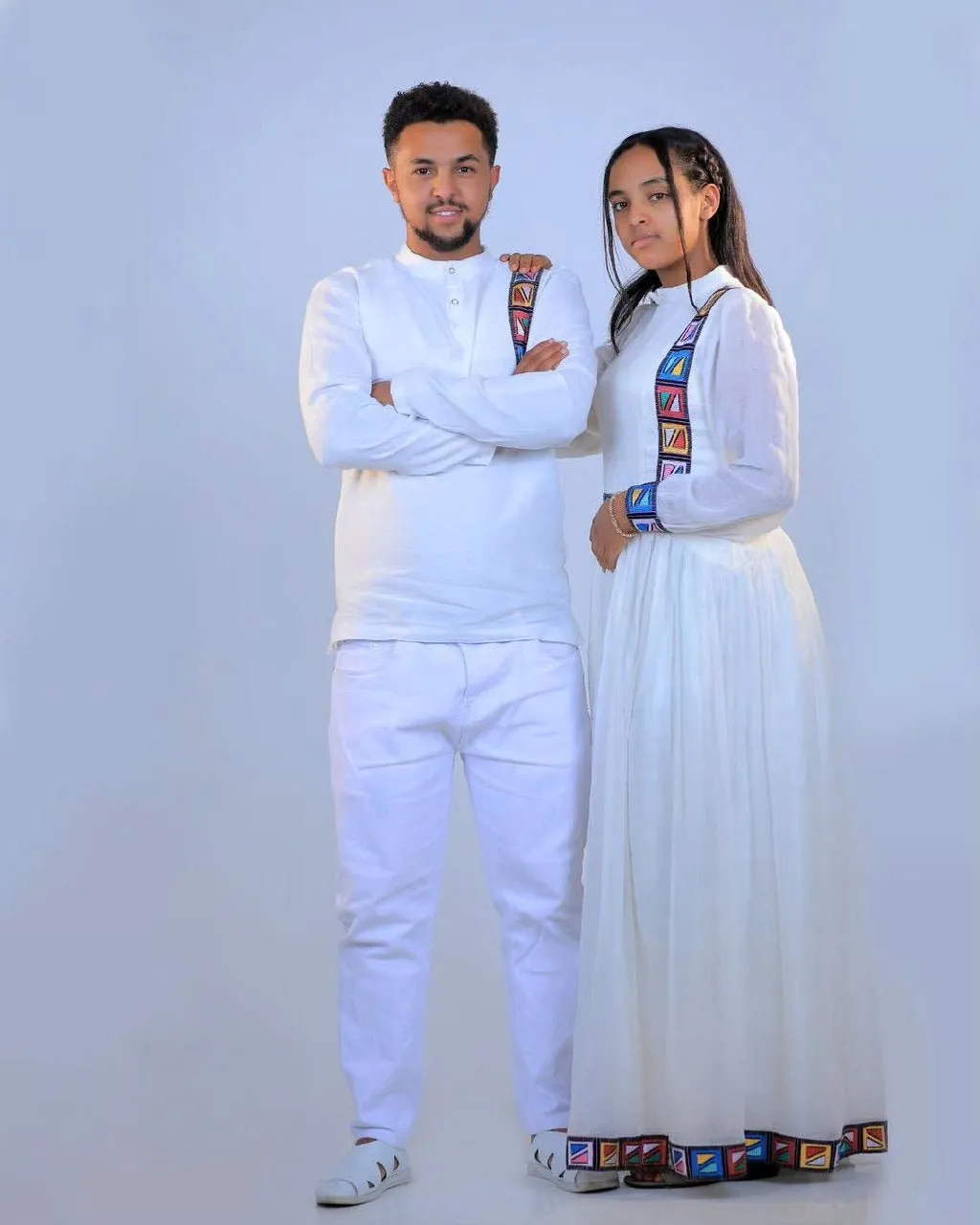 Modern and Colorful Habesha Couple's Outfits for a Stylish and Unique Look